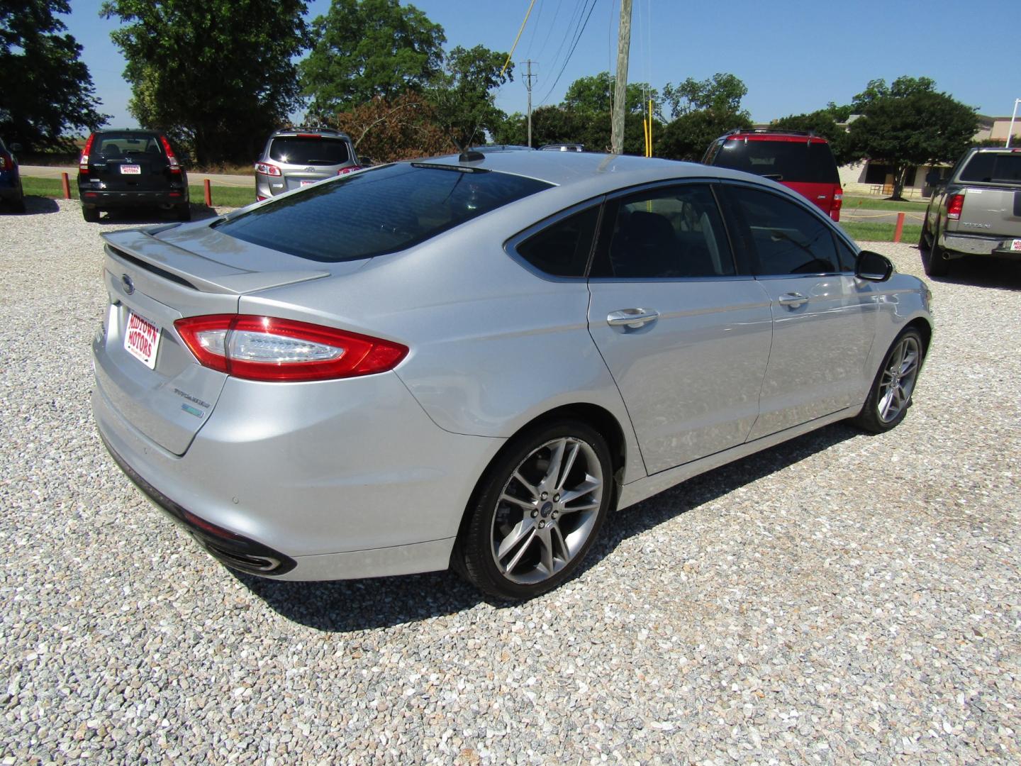 2016 Silver Ford Fusion Titanium (3FA6P0K96GR) with an 2.0L L4 DOHC 16V engine, Automatic transmission, located at 15016 S Hwy 231, Midland City, AL, 36350, (334) 983-3001, 31.306210, -85.495277 - Photo#7